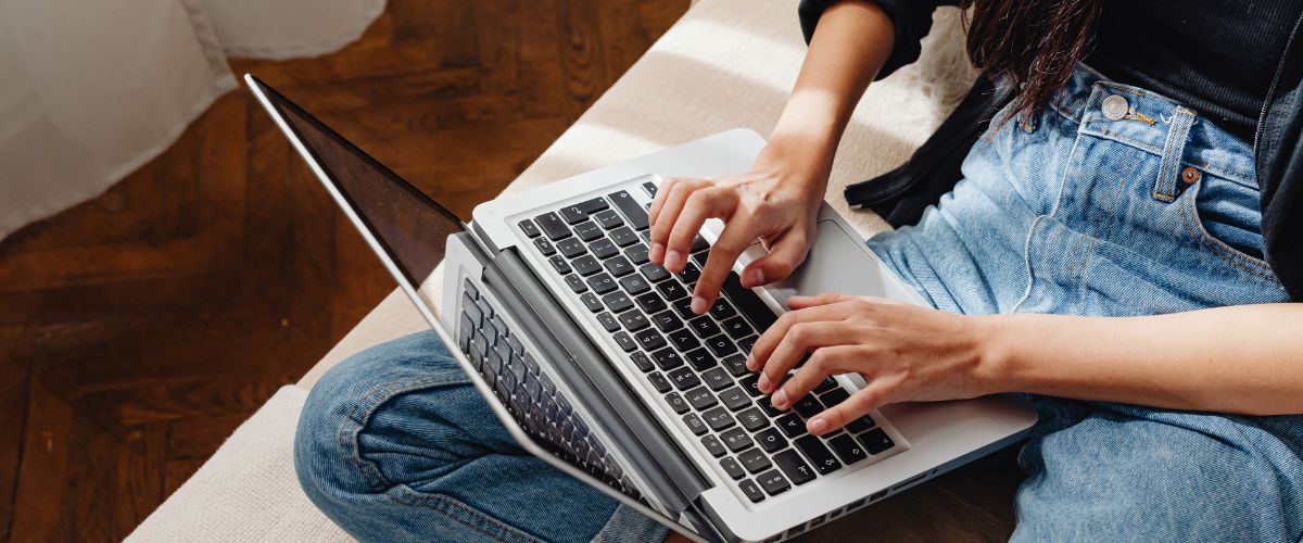 Girl typing on her laptop