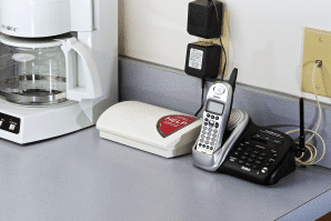 The home console plugged in next to a telephone